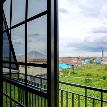 Oyo 90162 Remboelan Guest House Sungai Lutus Exterior foto